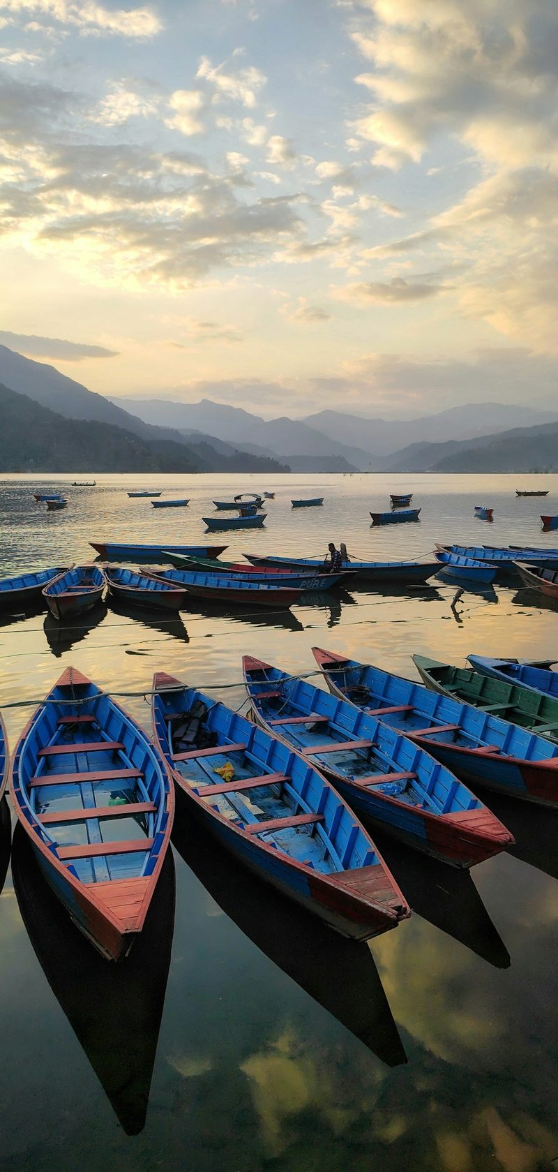 Wooden boats on Phewa Lake, Pokhara, at sunset